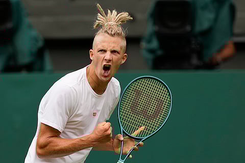 Mark Lajal of Estonia reacts after winning a point